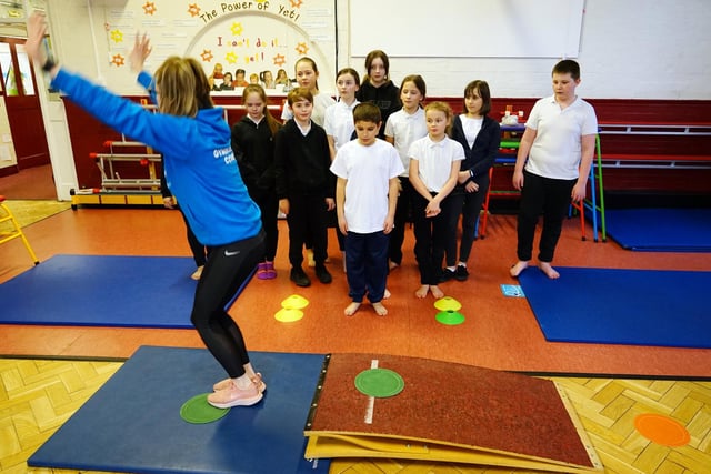 Flipping fantastic -year six youngsters at King Edward Primary School keenly watch Samantha Scotland schools co-ordinator at Beth Tweddle Gymnastics 
.