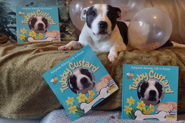 Tubby Custard with copies of his own Michelle Camm's new book all about him. Photo: Submitted
