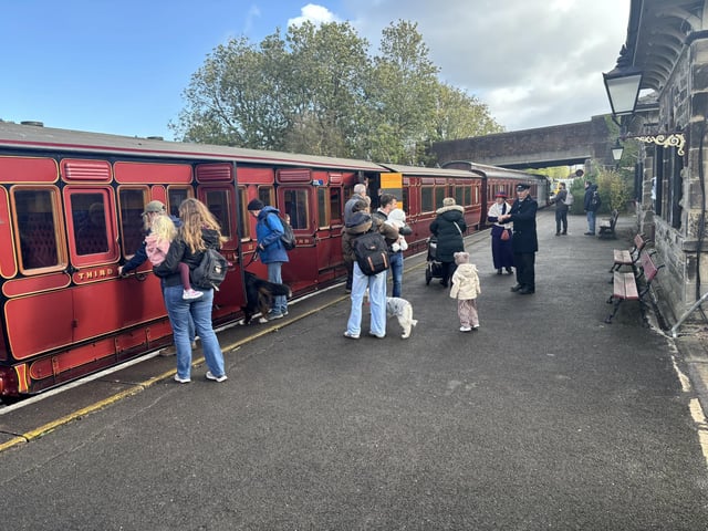 Visitors board an historic train at the Midland Railway Centre.