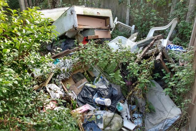A Hucknall man has been prosecuted for failing to clear a huge pile of rubbish from his garden