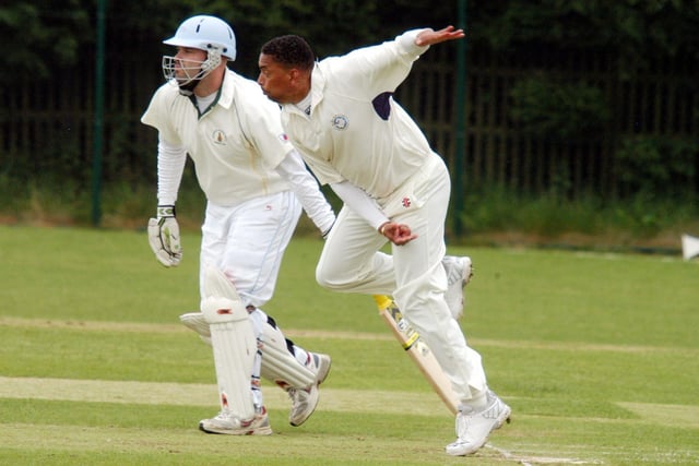 Former England cricket star Phil 'Daffy' DeFreitas is pictured bowling during the match between Mansfield Hosiery Mills and Papplewick.