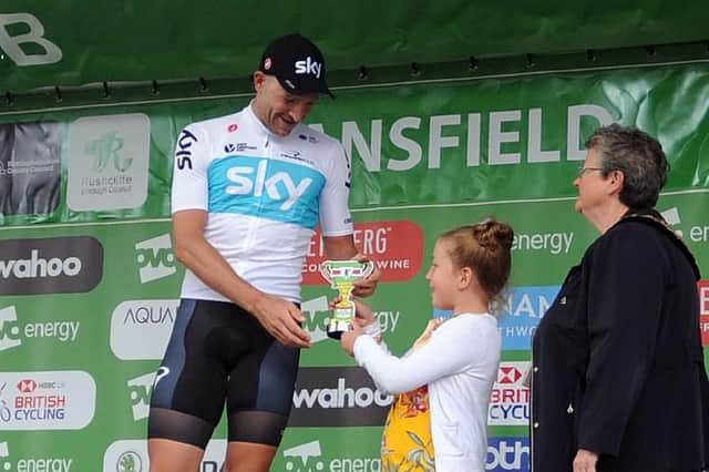 Team Sky's Ian Stannard receives his Nottinghamshire stage winner's trophy from competition winner Eva Smith back in 2018