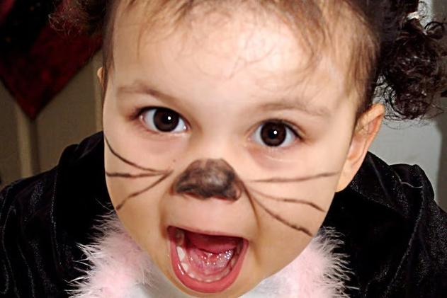 A little girl in fancy dress prepares to spook partygoers at the 2006 Hucknall Day Nursery Halloween party