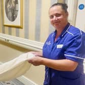 A resident helps with the housekeeping tasks at Hall Park Care Home in Bulwell. (Photo by: Hall Park Care Home)