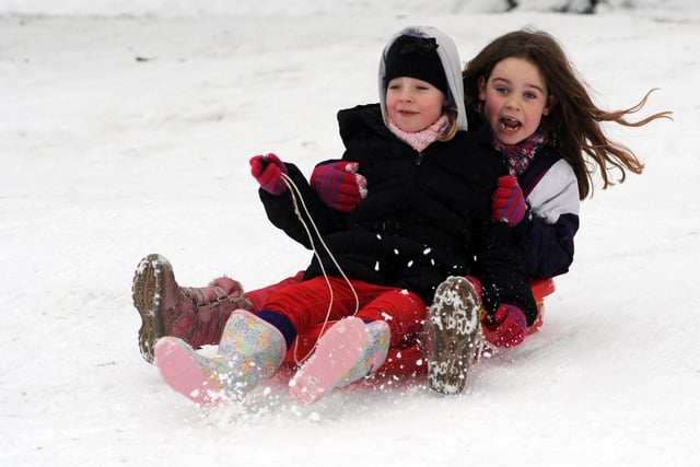 Snowfall in 2013 and Poppy Waller, seven, and Lily Kent, seven, are snapped enjoying a tough of sledging