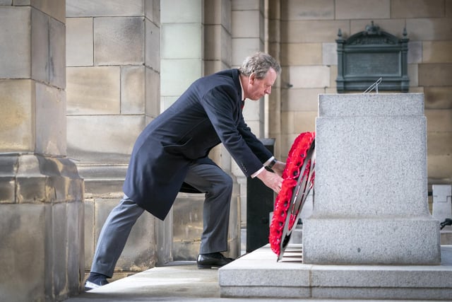 Scottish Secretary Alister Jack lays a wreath during the Remembrance Sunday service at the Stone of Remembrance outside Edinburgh City Chambers in Edinburgh.