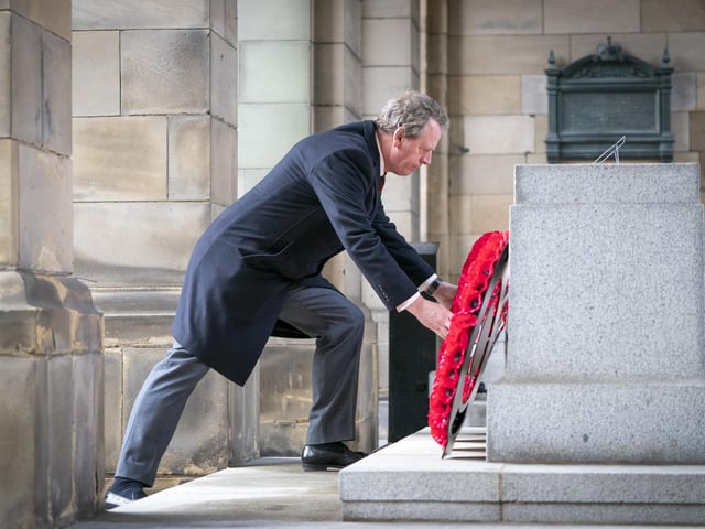 Scottish Secretary Alister Jack lays a wreath during the Remembrance Sunday service at the Stone of Remembrance outside Edinburgh City Chambers in Edinburgh.