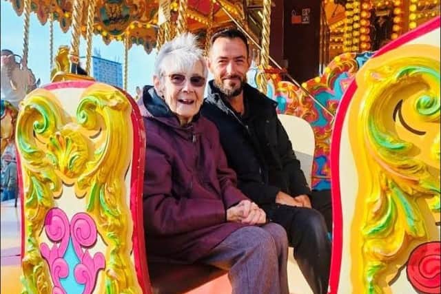 94-year-old Brenda Walton enjoying a ride on the carousel at the Goose Fair. Submitted
