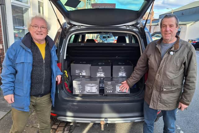 Hucknall Labour group chair Pat Ayres (right) and member John Wilkinson donating slow cookers to the food bank