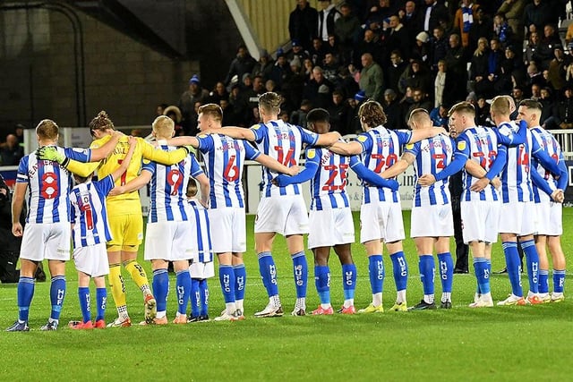 Hartlepool United players join in the silence before Friday evening's game.
