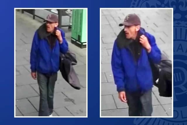 Police want to speak to this man after a woman was robbed at Nottingham cashpoint. Photo: Nottinghamshire Police