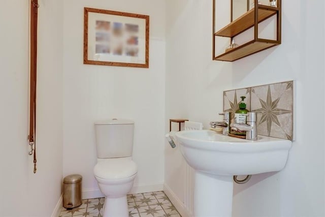 A downstairs toilet is always handy. This one comprises a low-level, dual-flush WC and a pedestal wash hand basin.
