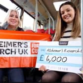 Scarlet McCourt (right) from Trentbarton, presents the cheque to Zoe Dean of Alzheimer's Research UK. Photo: Submitted