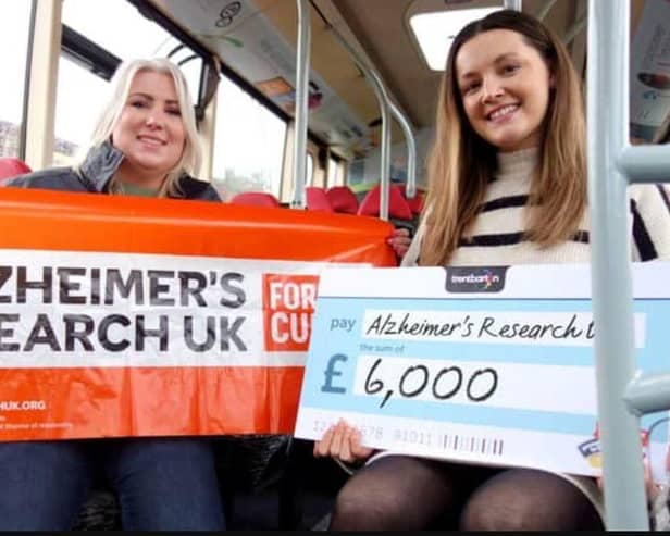 Scarlet McCourt (right) from Trentbarton, presents the cheque to Zoe Dean of Alzheimer's Research UK. Photo: Submitted