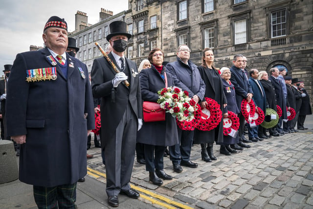 Dignitaries wait to lay their wreaths during the Remembrance Sunday service at the Stone of Remembrance outside Edinburgh City Chambers in Edinburgh.