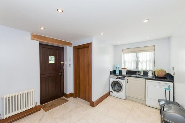 Just off the kitchen is this handy utility room. There is space for a washing machine and tumble dryer.