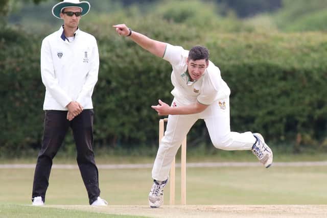 Harry Finch bowls for Hucknall against Wollaton.