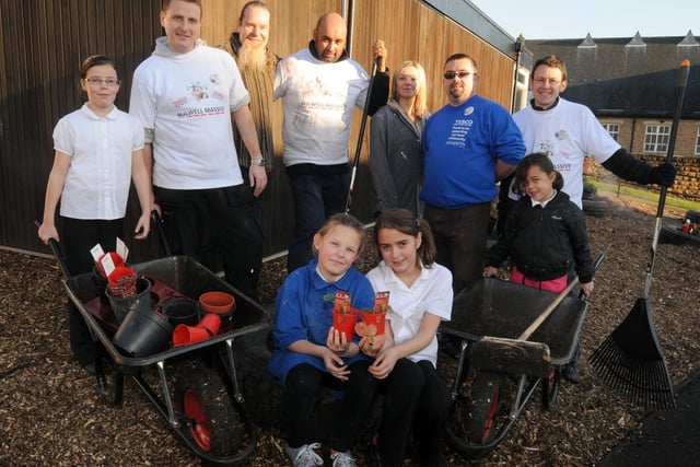 2010: Staff from Tesco Bulwell take part in a planting session at St Mary's Primary School along with pupils..