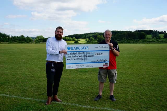Mark allagher, of The Arc, presents the cheque to Sports
