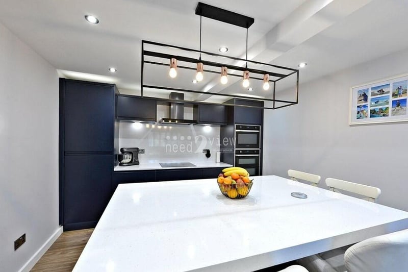 Ceiling light points give the kitchen/diner a sparkling look. Integrated appliances include a fridge/freezer and dishwasher.
