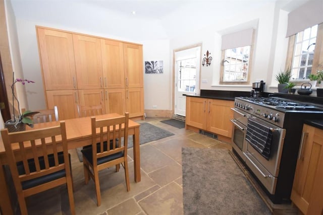 A second view at the kitchen diner, which boasts high-end appliances, including a Rangemaster cooker incorporating a double oven, grill, pan drawer, plate warmer and five-ring gas hob with wok stand. As you can see, the generously-sized room has space for a dining table and chairs.