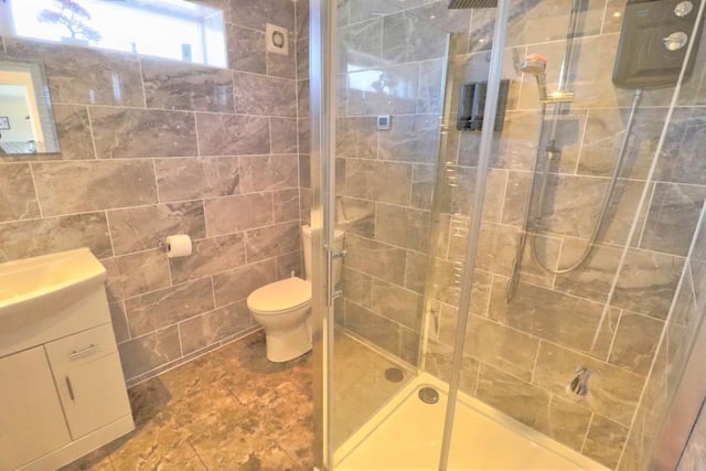 Recently fitted on the ground floor by the current owners is this sparkling shower room. It has a contemporary, two-piece suite, fully tiled walls and underfloor heating.