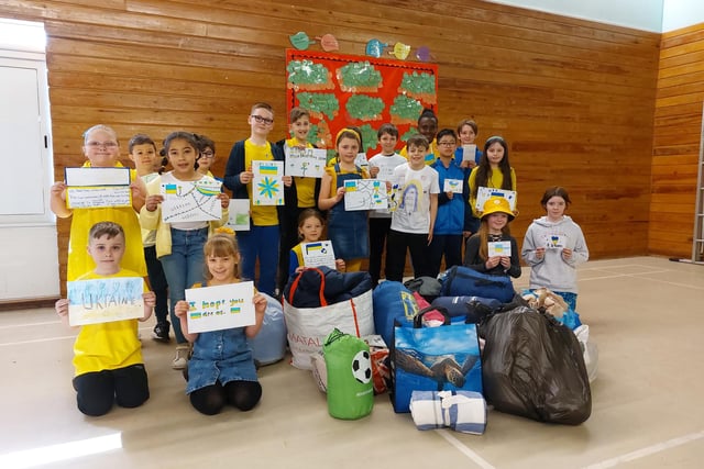 Pupils of Edgewood Primary School with some of their Letters of Hope and donations for the sleeping-bag appeal
