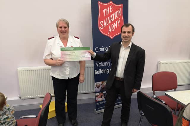 Coun Waters presents the cheque for £500 to Gayner Ward, Hucknall Salvation Army captain