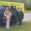 Chris Handley, with daughter April and granddaughter Summer and members of the emergency care team who saved his life. Photo: Submitted