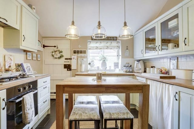 The fitted dining kitchen at the £270,000 cottage has a distinctively rustic feel to it. Appliances include an integrated oven with a gas hob and extractor fan, while there is space and plumbing for a washing machine and an under-counter fridge.