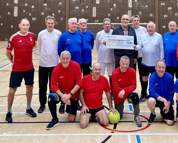 The Gerri Hat-tricks football team present their cheque to Peter Dickens from Titchfield Park Bowls Club. Photo: Submitted