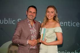 Erin Cunningham-Burley receiving her award from Derbyshire Times editor Phil Bramley. Photo: Dean Atkins