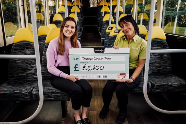 Trentbarton team members Scarlet McCourt (left) and Caroline Bacon-Webster with the cheque for the Teenage Cancer Trust. Photo: Mark Averill