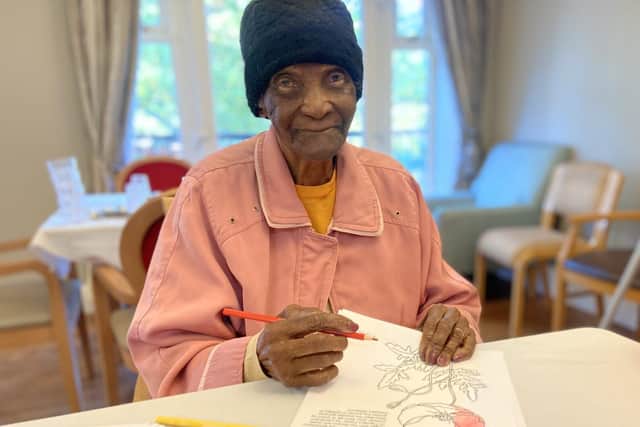 resident Lilla enjoys our art and crafts session