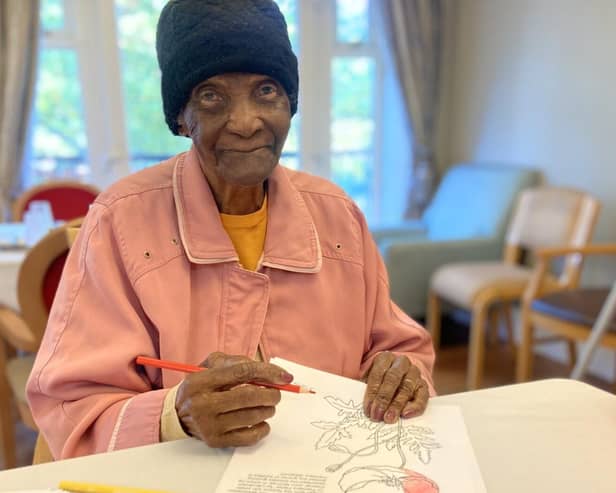 resident Lilla enjoys our art and crafts session