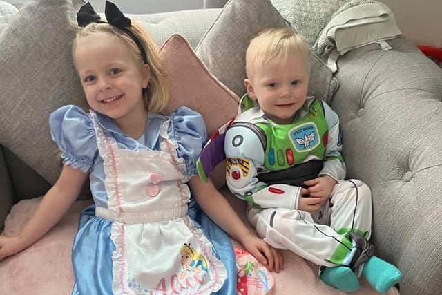 Three-year old Darcy as Alice in Wonderland and 17-month-old Colbie as Buzz Lightyear