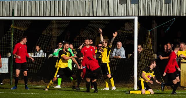 Hucknall Town fans watch their side score against Shirebrook Town. Pic by Lee Fox Photography.