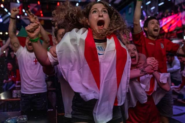 England fans cheer during the semi-final match between England and Denmark (Photo by Dan Kitwood/Getty Images)