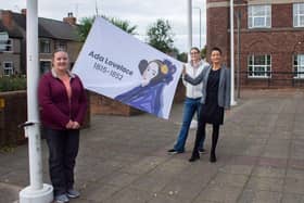 Couns Samantha Deakin (left) and Helen-Ann Smith, together with council chief executive Theresa Hodgkinson (right) raise the Ada Lovelace flag