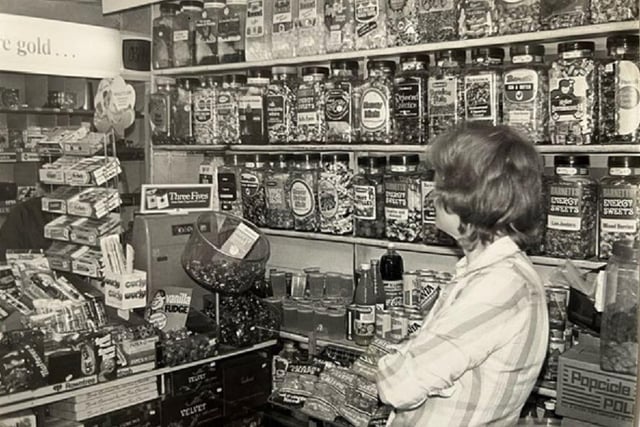 A school kid's dream - shelves packed with jars of sweets