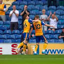 George Maris celebrates the opening goal against Newport County.