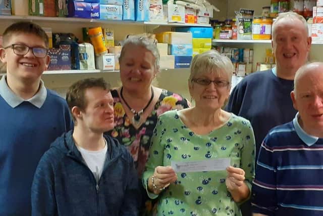 Yvonne Campbell (centre) project manager of Hucknall Food Bank with residents from Hope Lea, who visited and helped out for the day.