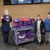 The children donated nearly 300 selection boxes to the QMC
