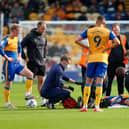 Mansfield Town midfielder George Maris receives treatment on Saturday. Photo by Chris Holloway/The Bigger Picture.media