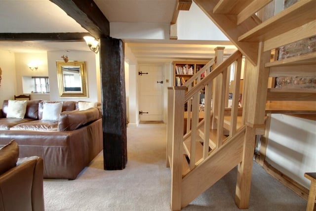 A door from the lounge gives access to the garage and bar, while an oak staircase leads to the first floor, which is where we are heading next.