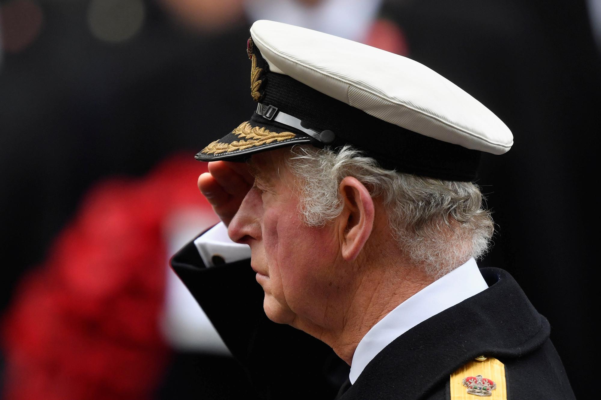 Emotion etched on Prince Charles' face as he lays wreath on behalf of ...