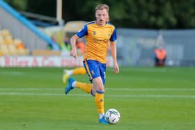 George Maris has extended his stay at Mansfield Town.