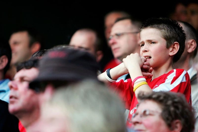 A young Nottingham Forest fan bites his fingers during the Coca-Cola Championship match between Queens Park Rangers and Nottingham Forest at Loftus Road Stadium on April 30, 2005.