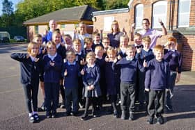 Newstead Primary School pupils celebrate their good Ofsted report with headteacher Helen Woodward, deputy headteacher John Oldfield, chair of governors Andrew Raynor and literacy lead Susanne McGeary.