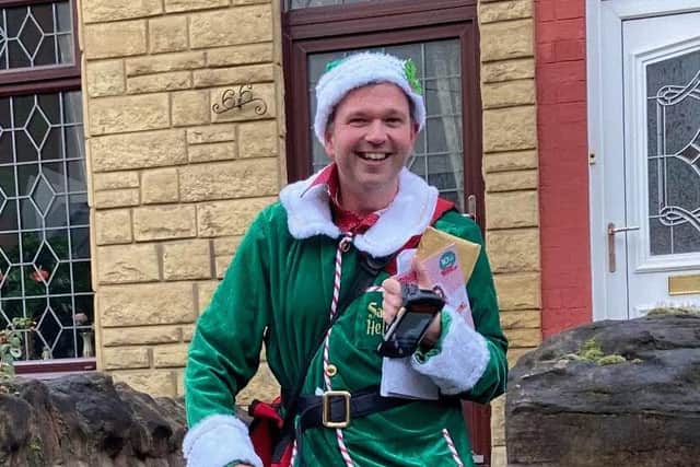 Postman Lee Poultney has been dressing as an elf to bring some festive cheer